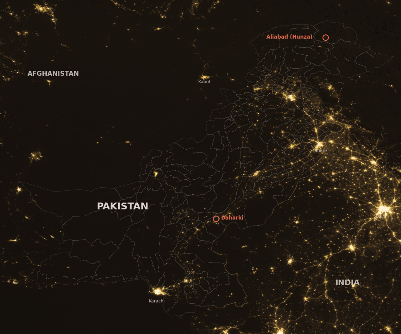 VIIRS night-time radiance over Pakistan, with India and Afghanistan alongside: the Indus valley and Punjab glow, Balochistan and the mountain north are near dark; Daharki and Aliabad are circled